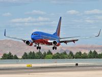 N429WN @ KLAS - Southwest Airlines / 2002 Boeing 737-7H4 / You can see the right-side engine reflecting off the body! Check it out with a magnifying glass. Cool...! - by SkyNevada - Brad Campbell