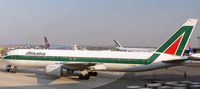 EI-CRM @ EWR - Alitalia 767-343 'Amerigo Vespucci' takes advantage of a tow truck to negotiate the tight apron at Newark. - by Daniel L. Berek