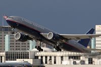 N225UA @ LAX - United Airlines N225UA (FLT UAL934) departing RWY 25R late in the day enroute to Heathrow (EGLL) - London, England. Note the condensation at the face of both engines. - by Dean Heald