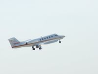 N995CR @ PDK - Departing PDK against a bright sun - by Michael Martin