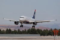 N839AW @ LAS - US Airways N839AW (FLT AWE736) seconds away from touchdown on RWY 25L after a 51-minute flight from San Diego, CA (KSAN). - by Dean Heald
