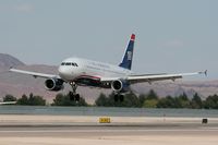 N839AW @ LAS - US Airways N839AW (FLT AWE736) seconds away from touchdown on RWY 25L after a 51-minute flight from San Diego, CA (KSAN). - by Dean Heald
