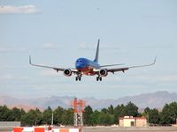 N470WN @ KLAS - Southwest Airlines / 2004 Boeing 737-7H4 / Caught 3 Helicopters flying in formation on their way to Lake Mead - by SkyNevada - Brad Campbell