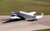 N961GP @ DPA - Beech 18 with a nose job taxiing by the control tower - by Glenn E. Chatfield