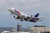 N562FE @ LAX - FedEx N562FE (FLT FDX3019) climbing out from RWY 25L enroute to Chicago Ohare Int'l (KORD), Illinois.
