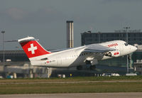HB-IXH @ EGCC - Swiss RJ blasting past the terminals. - by Kevin Murphy