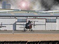 UNKNOWN @ VGT - This Helicopter with an Aircraft right behind it looked a little surreal to me - I thought an evil looking sky was only fitting. - by SkyNevada - Brad Campbell