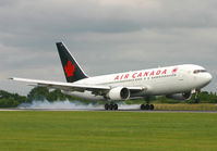 C-FBEF @ EGCC - Smokey landing on 06R. - by Kevin Murphy