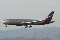 VP-BAV @ LAX - Russian 767 over the Hollywood sign. - by Kevin Murphy