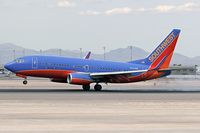 N422WN @ LAS - Southwest Airlines N422WN main gear touchdown on RWY 25L.
