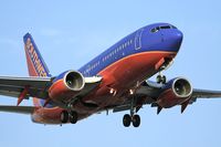 N234WN @ LAX - Southwest Airlines N234WN (FLT SWA969) from McCarran Int'l (KLAS) - Las Vegas, Nevada, on short-final for RWY 24R. - by Dean Heald
