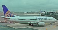 N16301 @ EWR - One of Continental's many 737-300s takes a break at Newark. - by Daniel L. Berek