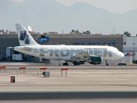 N939FR @ KLAS - Frontier Airlines - 'Penguins' / 2005 Airbus A319-111 - by SkyNevada - Brad Campbell