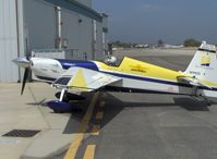 N111CD @ SZP - 1999 Zivco EDGE 540, Lycoming AEIO-540 330 Hp, taxi to hangar, note visored helmet - by Doug Robertson