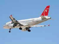 N370NB @ KLAS - Northwest Airlines / 2003 Airbus A319-114 - by SkyNevada - Brad Campbell