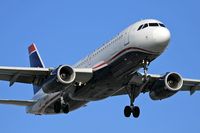 N659AW @ LAX - US Airways N659AW operating as America West (FLT AWE708) from Phoenix Sky Harbor Int'l (KPHX) on final approach to RWY 24R. - by Dean Heald