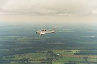 N9901Q - Bob Bradbury in flight from OSH 2004 - by Ron Drake