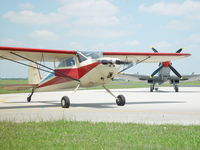 N3756V @ 50R - 140 next to a Spitfire 2005 - by John Cyrier