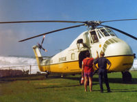 N73538 - A mighty Sikorsky H-34 rescue chopper stands by on a day of particularly rough surf at Waiameia, on Oahu's western coast, in 1974. - by Daniel L. Berek