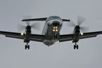 UNKNOWN @ LAX - Skywest Airlines EMB-120 Brasilia on final approach to LAX RWY 24R.