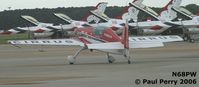 N68PW @ LFI - Patty taxiing out for her show, almost matching the Thunderbirds - by Paul Perry