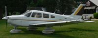 N81669 @ N40 - The earth tones of this 1980-vintage Piper Warrior II blend in well with the natural surroundings at Sky Manor Airport, Pittstown, NJ. - by Daniel L. Berek
