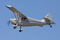 N9653K @ CPM - Universal Stinson 108-2 Scott's Super Stinson 260HP - N9653K - climbing out from RWY 25L to begin a banner towing flight.  This airplane had an engine conversion to a Lycoming O-540, 260HP.