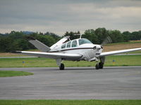 N390HW @ FDK - Horan West Aviation 1967 V35A just arriving at the AOPA Fly-in from Princeton, NJ (39N).  Look at the anticipation on on the passengers faces. - by Sam Andrews