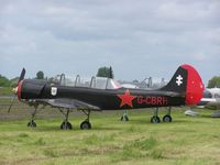 G-CBRH - Yak52 on a cloudy day at Keevil
