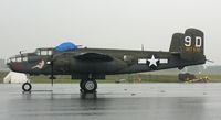 N9456Z @ RDG - MAAM's beautifully restored B-25J, Briefing Time (44-29939), waits out a thunder shower. - by Daniel L. Berek