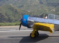 N4995C @ SZP - North American T-6G TEXAN (1949 factory reman) 'Thirsty Girl' fast taxi toward hangar after landing - by Doug Robertson
