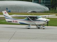OE-DID @ SZG - Taxiing to runway 34 in front of the famous Hangar 7 - by Alexander Gerzabek