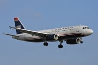 N619AW @ LAX - America West (in US Airways colors) N619AW (FLT AWE708) from Phoenix Sky Harbor Int'l (KPHX) on final approach to RWY 24R. - by Dean Heald
