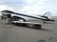 N115SA @ CNO - First Flight Inc. Douglas DC-3C with wings unbolted @ Chino Municipal Airport, CA - by Steve Nation