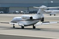 N978QS @ SMO - 2002 Cessna 750 Citation X N978QS, from Las Vegas McCarran Int'l (KLAS), applying the thrust reversers after landing on RWY 21.  Note that the right side reverser is deployed, but not the left.