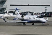 N254FX @ SMO - 2002 Bombardier Learjet 60 N254FX taxiing to RWY 21 for departure to Metropolitan Oakland Int'l (KOAK).