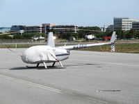 N45PG @ SCA - Dewitte Enterprises 2001 Robinson R44 with cockpit cover @ San Carlos Municipal Airport, CA - by Steve Nation