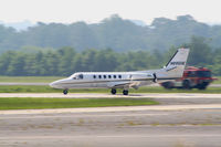 N895HE @ PDK - Landing Runway 2R with DeKalb Fire Services in background - by Michael Martin
