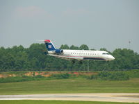 N426AW @ CLT - Landing on Runway 18R - by Damon Warren