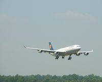 D-AIGO @ CLT - Landing on Runway 18R - by Damon Warren