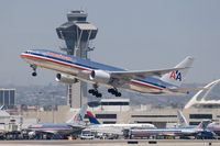 N768AA @ LAX - American Airlines N768AA (FLT AAL169) climbing out from RWY 25R enroute to Narita Int'l (RJAA). - by Dean Heald