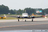 N41AY @ PDK - Head on view - Headlights on Highbeam! - by Michael Martin