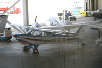 N9063D @ PDK - In Epps Air Service hanger with various other aircraft. - by Michael Martin
