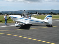 N459B @ WVI - Concerned owner of 2000 Williams VANS RV-4 homebuilt checks for dings on wheel pants after abortive attempt by fly-in marshalls to park him in the grass @ Watsonville Municipal Airport, CA - by Steve Nation