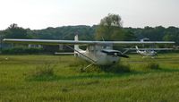 N6215T @ FWN - A 1964-vintage Cessna two-seater and a more recent sistership enjoy an summer evening at Sussex. - by Daniel L. Berek