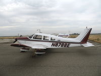 N8788E @ MER - 1976 Piper PA-28-181 in lousy weather @ Castle AFB, CA - by Steve Nation