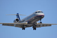N960SW @ LAX - United Express (operated by SkyWest) N960SW (FLT SKW6477) from Sacramento Int'l (KSMF) on final approach to RWY 24R.