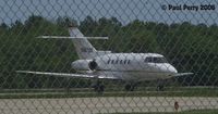 N887QS @ PHF - Yeah, like I wouldn't shoot through a fence! - by Paul Perry