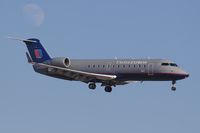 N961SW @ LAX - United Express (operated by SkyWest) N961SW (FLT SKW6507) from Metropolitan Oakland Int'l (KOAK) on final approach to RWY 24R with the moon in the background.