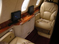 N444CX @ KBLM - tv's for each seat nice touch - by William Hughes